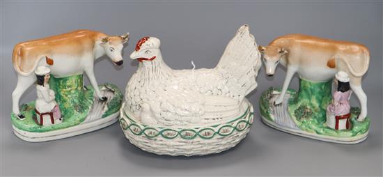 A pair of Staffordshire pottery cow and milk maid groups and a hen dish and cover Staffordshire group 16cm high